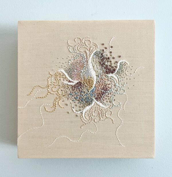 Abstract embroidery in a tight composition using muted colours