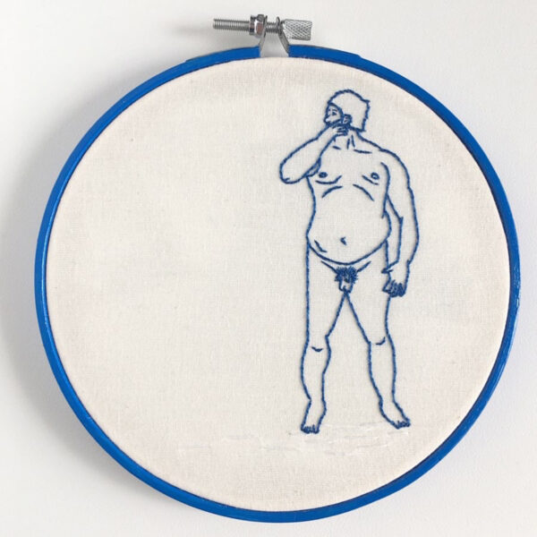 An embroidered piece of a male figure in a blue line on a white background.